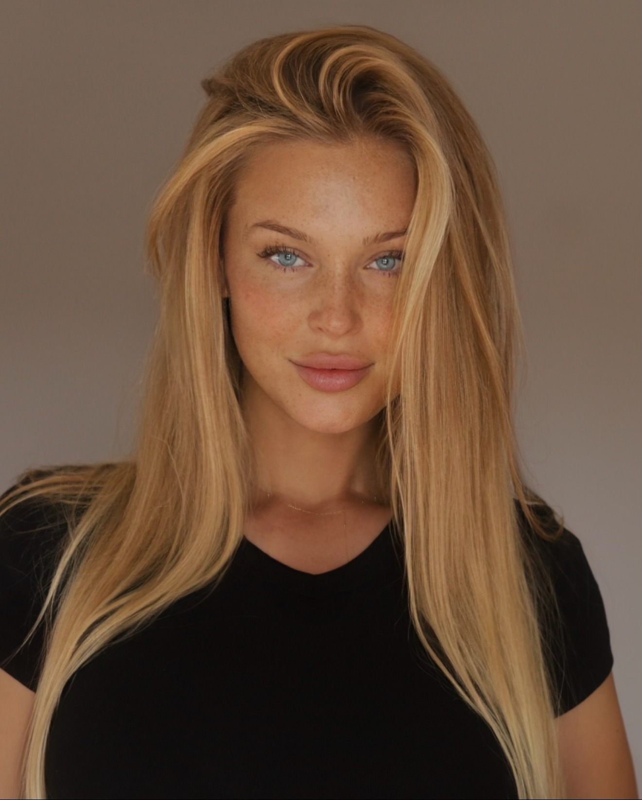 Olga Tarasiuk wearing a black top, portrait with direct gaze